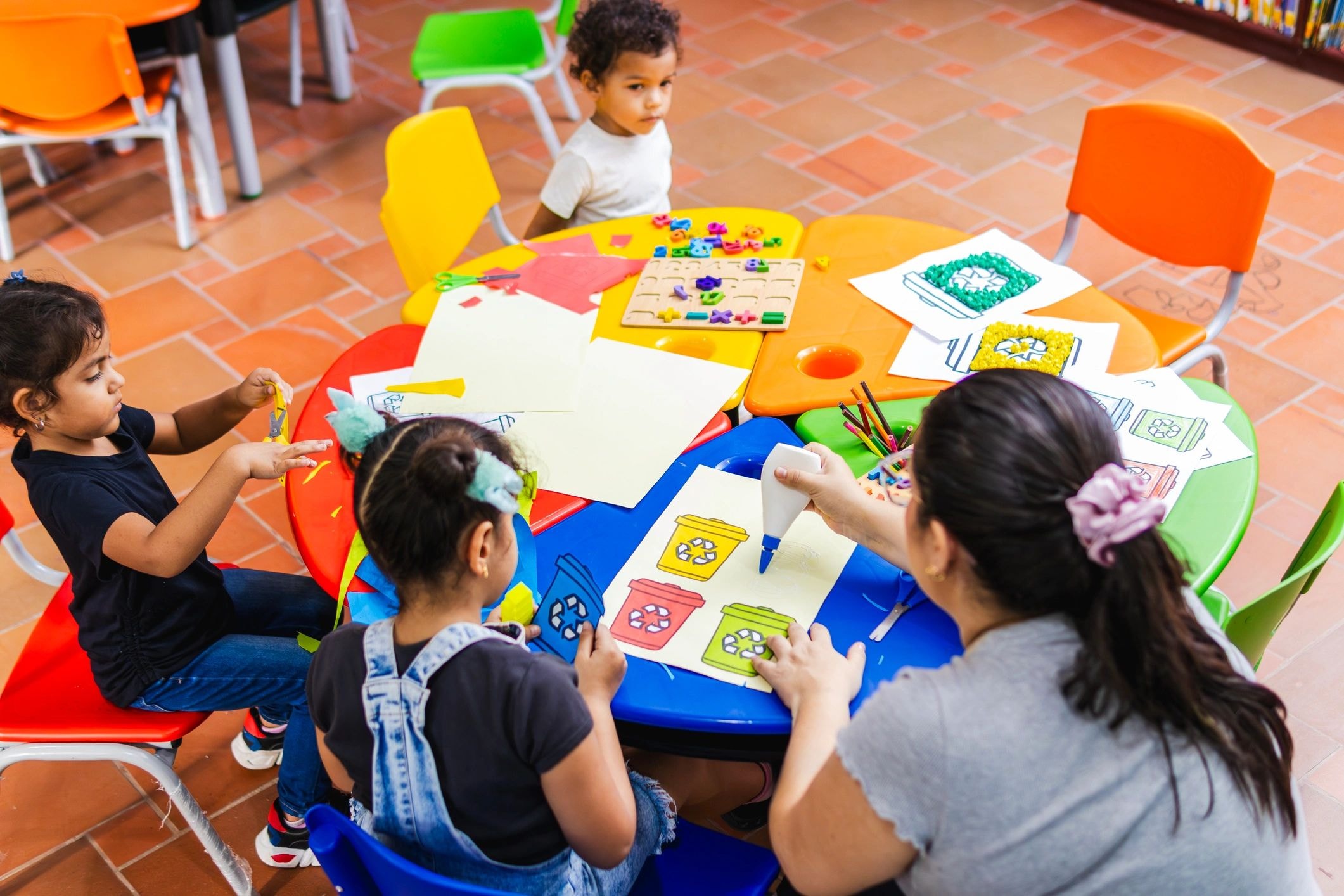 Children engaged in colorful classroom learning activities